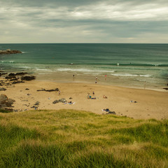 Lawn to the beach with cloudy sky