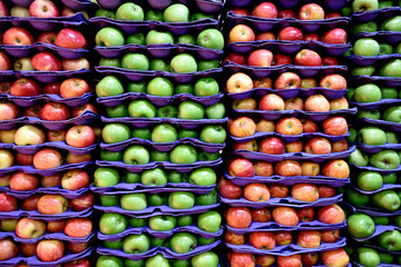 Apples, green and red, stacked, rows, patterns, in market, in Colombia.