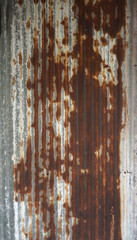 Brown rusty stain on corrugated zinc panel outdoor