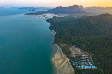 Obraz premium Tup Kaek beach close to Kwang beach and Ngon Nak mountain during low tide .can see long and large beach can walk around many big rocks on the beach .beautiful sunset behind archipelago in Andaman sea