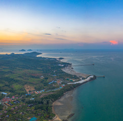 Tup Kaek beach close to Kwang beach and Ngon Nak mountain during low tide .can see long and large beach can walk around many big rocks on the beach .beautiful sunset behind archipelago in Andaman sea