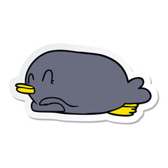 sticker of a penguin lying on belly