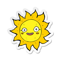 sticker of a cartoon happy sun