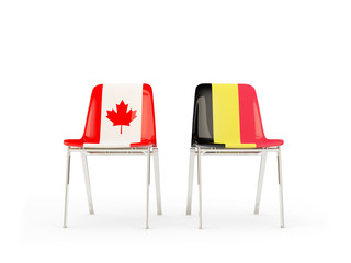 Two chairs with flags of Canada and belgium