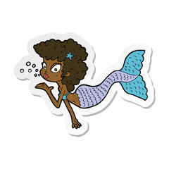 sticker of a cartoon mermaid blowing kiss