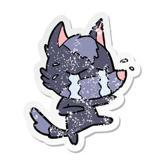 distressed sticker of a cartoon crying wolf