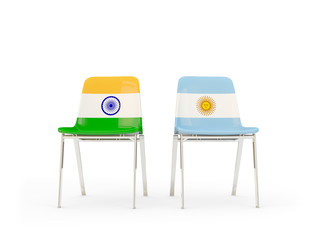 Two chairs with flags of India and argentina