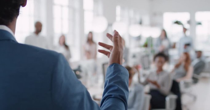 businessman team leader presenting in office meeting colleagues sharing leadership ideas in office training presentation seminar