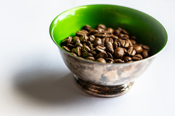 coffee beans in a bowl isolated on white