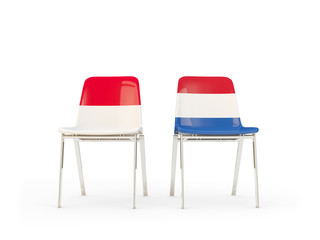 Two chairs with flags of Indonesia and netherlands
