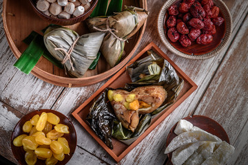 Chinese New Year party table with food and traditional decorations.