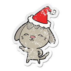 happy distressed sticker cartoon of a dog wearing santa hat