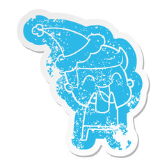 cartoon distressed sticker of a man laughing wearing santa hat