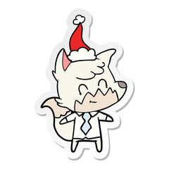 sticker cartoon of a friendly fox wearing santa hat