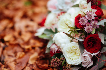 Wedding flowers, bridal bouquet closeup. Decoration made of roses, peonies and decorative plants, close-up, selective focus, nobody, objects