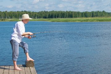 landscape of water, sky and horizon, there is a place for the inscription, a man fishing