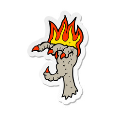 sticker of a cartoon spooky claw