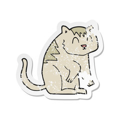 retro distressed sticker of a cartoon cat