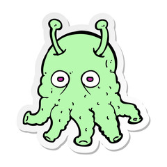 sticker of a cartoon space alien