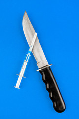 Knife and a Syringe