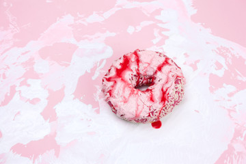 sweet donut on a white and pink background
