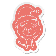 happy cartoon  sticker of a lion wearing santa hat