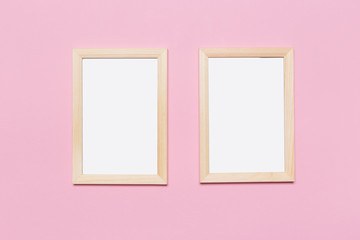 blank frame on a pastel pink background