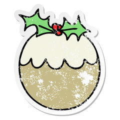 distressed sticker of a quirky hand drawn cartoon christmas pudding