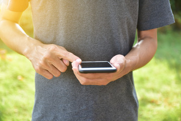 Man holding mobile smart phone using smart application by internet online