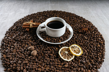 Coffee cup and beans on old kitchen table.