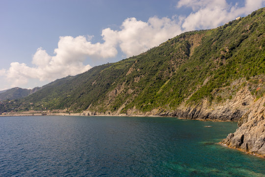 Italy, Cinque Terre, Manarola, a large body of water with a mountain in the background