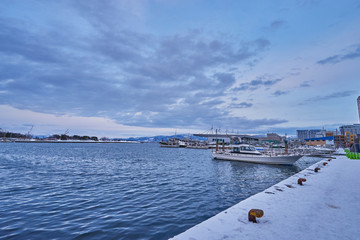 Fototapeta premium Port around Kanemori Red Brick Warehouse in winter season at Hakodate city, Hokkaido, Japan.