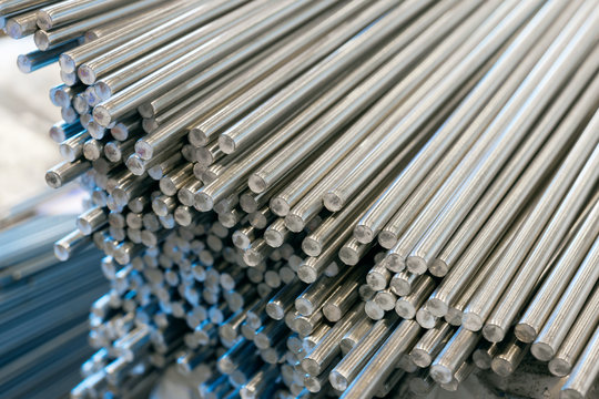 A bundle of stainless steel bars. Large industrial warehouse metal