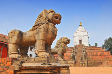 Fototapeta premium Stone Lions east of Durbar Square with Fasidega Temple in Bhaktapur, Nepal.