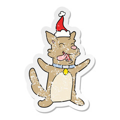 distressed sticker cartoon of a happy dog wearing santa hat