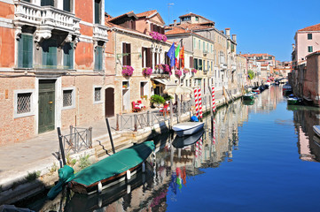 Fototapeta na wymiar Venice cityscape narrow water canal bridge and traditional buildings. Italy Europe.