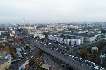 Aerial view of the city district. A wide road passes through the city