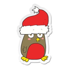 sticker of a cartoon christmas robin wearing santa hat