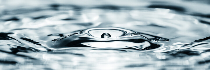 Water droplet splash backgound texture isolated on black. Fresh clean pure water ripples and...