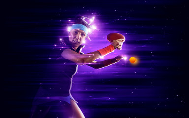 Woman playing ping pong on dark blue - obrazy, fototapety, plakaty