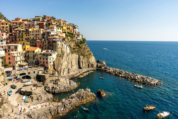 Fototapeta na wymiar Italy, Cinque Terre, Manarola, Manarola, PANORAMIC VIEW OF SEA AND BUILDINGS AGAINST CLEAR BLUE SKY