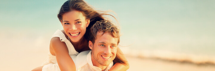 Banner of happy young people in love piggybacking on beach honeymon vacation background. Couple...