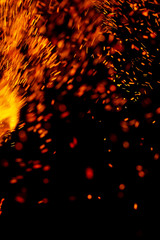 flame of fire with sparks on a black background