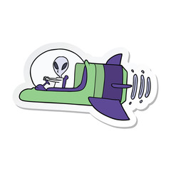 sticker of a cartoon alien spacecraft