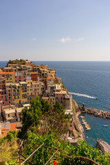 Fototapeta na wymiar Italy, Cinque Terre, Manarola, Manarola, HIGH ANGLE VIEW OF BUILDINGS BY SEA AGAINST SKY