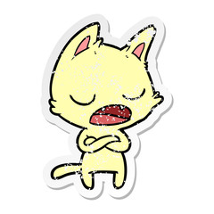 distressed sticker of a talking cat with crossed arms