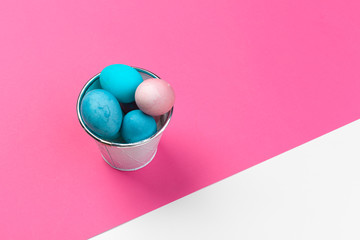 Candy color easter eggs over bright paper background