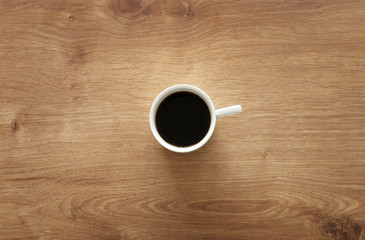 coffee cup over wooden table . top view