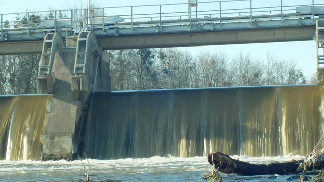 Weir On Morava River, Hydro-electric Power Station, in winter frozen water flowing down with ice and icicles, Central Moravia, Czech Republic, Europe