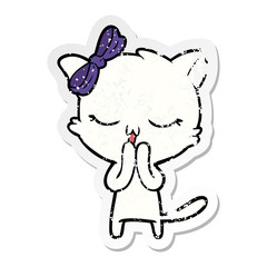 distressed sticker of a cartoon cat with bow on head
